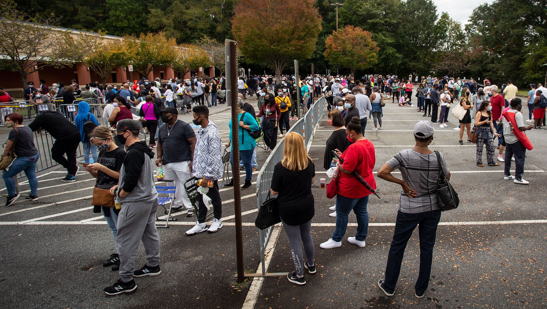 Hundreds of people wait in line for early voting on Monday, Oct. 12, 2020, in Marietta, Georgia Hundreds of people wait in line for early voting on Monday, Oct. 12, 2020, in Marietta, Georgia - Sputnik International, 1920, 29.03.2021