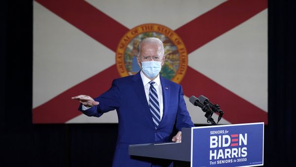 The Florida state flag hands behind Democratic presidential candidate former Vice President Joe Biden as he speaks at Southwest Focal Point Community Center in, Pembroke Pines, Fla., Tuesday Oct. 13, 2020 - Sputnik International