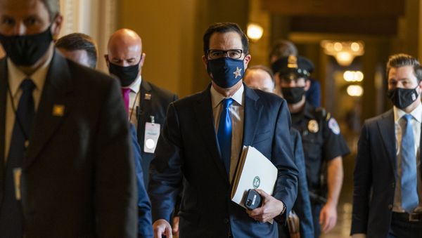Treasury Secretary Steven Mnuchin, center, walks from the office of Senate Majority Leader Sen. Mitch McConnell of Ky., as he leaves the Capitol, Wednesday, Sept. 30, 2020, in Washington. Treasury Secretary Steven Mnuchin, center, walks from the office of Senate Majority Leader Sen. Mitch McConnell of Ky., as he leaves the Capitol, Wednesday, Sept. 30, 2020, in Washington. - Sputnik International