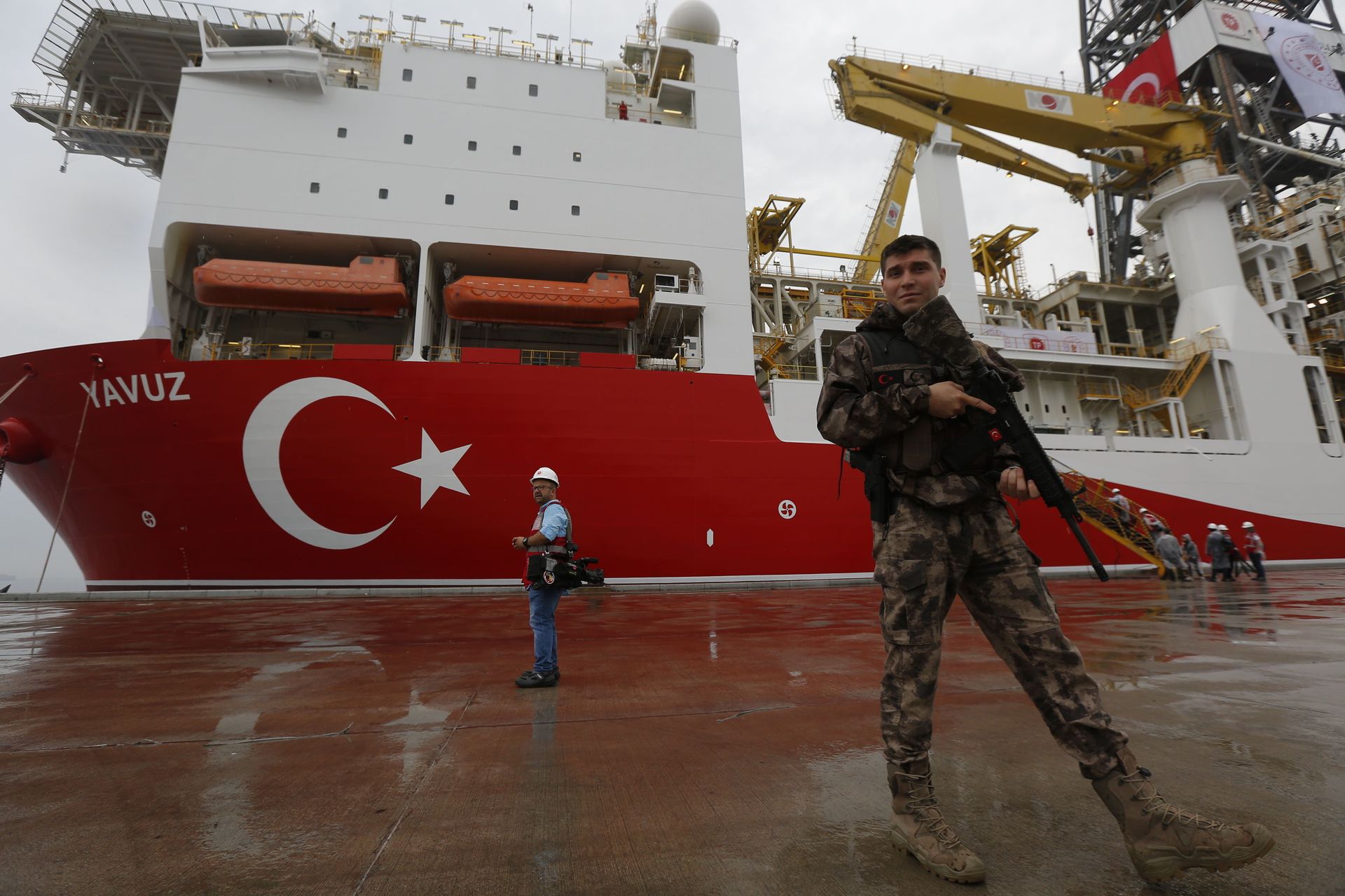 FILE - In this Thursday, June 20, 2019 file photo, a Turkish police officer patrols the dock, backdropped by the drilling ship 'Yavuz' scheduled to be dispatched to the Mediterranean, at the port of Dilovasi, outside Istanbul FILE - In this Thursday, June 20, 2019 file photo, a Turkish police officer patrols the dock, backdropped by the drilling ship 'Yavuz' scheduled to be dispatched to the Mediterranean, at the port of Dilovasi, outside Istanbul - Sputnik International, 1920, 07.09.2021