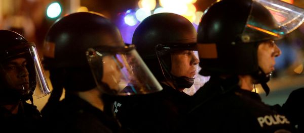 Police officers watch demonstrators as they continue to protest after the not guilty verdict in the murder trial of Jason Stockley, a former St. Louis police officer, charged with the 2011 shooting of Anthony Lamar Smith, who was Black, in St. Louis, Missouri, U.S., September 17, 2017. Police officers watch demonstrators as they continue to protest after the not guilty verdict in the murder trial of Jason Stockley, a former St. Louis police officer, charged with the 2011 shooting of Anthony Lamar Smith, who was Black, in St. Louis, Missouri, U.S., September 17, 2017. - Sputnik International