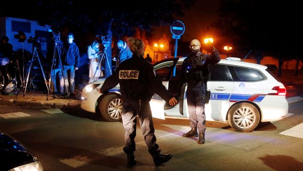 Police officers secure the area near the scene of a stabbing attack in the Paris suburb of Conflans St Honorine, France, October 16, 2020. REUTERS/Charles Platiau - Sputnik International