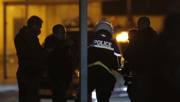 French police officers gather outside a high school after a history teacher who opened a discussion with students on caricatures of Islam's Prophet Muhammad was beheaded, Friday, Oct. 16, 2020 in Conflans-Saint-Honorine, north of Paris. Police have shot the suspected killer dead. - Sputnik International