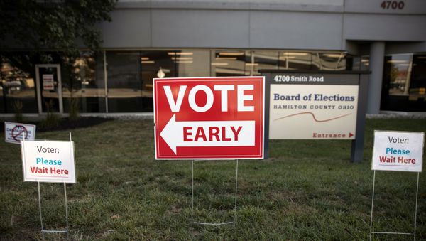 Early voting signs are placed outside of the Hamilton County Board of Elections building for the upcoming presidential election, as early voting begins in Cincinnati, Ohio, U.S., October 6, 2020. REUTERS/Megan Jelinger Early voting signs are placed outside of the Hamilton County Board of Elections building for the upcoming presidential election, as early voting begins in Cincinnati, Ohio, U.S., October 6, 2020. REUTERS/Megan Jelinger - Sputnik International