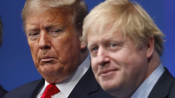 British Prime Minister Boris Johnson, right, and U.S. President Donald Trump pose during a group photo during a NATO leaders meeting at The Grove hotel and resort in Watford, Hertfordshire, England, Wednesday, Dec. 4, 2019 British Prime Minister Boris Johnson, right, and U.S. President Donald Trump pose during a group photo during a NATO leaders meeting at The Grove hotel and resort in Watford, Hertfordshire, England, Wednesday, Dec. 4, 2019 - Sputnik International