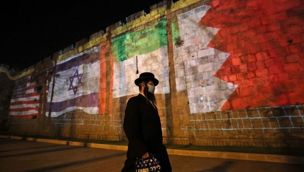 The flags of US, Israel, United Arab Emirates, and Bahrain are projected on the ramparts of Jerusalem's Old City on September 15, 2020 in a show of support for Israeli normalisation deals with the United Arab Emirates and Bahrain. - Sputnik International