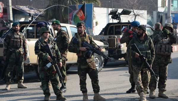 Afghan security personnel keep watch along a street after an attack from a building close to the Pakistan consulate in Jalalabad (File) - Sputnik International