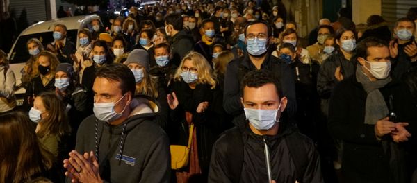 People attend a silent march to pay tribute to Samuel Paty, the French teacher who was beheaded on the streets of the Paris suburb of Conflans-Sainte-Honorine, France, October 20, 2020 - Sputnik International