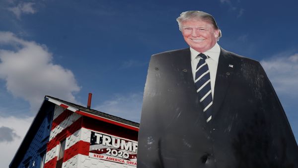 A 14-foot cutout of U.S. President Donald Trump stands on the front lawn of the self-proclaimed 'Trump House' in Youngstown, Pennsylvania, U.S., October 21, 2020. - Sputnik International