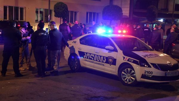 Law enforcement officers and investigators gather in a street near a branch of the commercial Bank of Georgia after an unidentified gunman took hostages in the town of Zugdidi, Georgia October 21, 2020.  - Sputnik International
