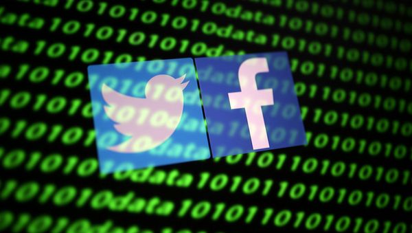 Twitter and Facebook logo along with binary cyber codes Twitter and Facebook logo along with binary cyber codes - Sputnik International