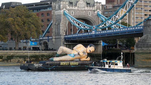An inflatable Borat character promoting movie Borat Subsequent Moviefilm is carried along the River Thames from Tower Bridge aboard a barge, in London, Britain October 22, 2020. An inflatable Borat character promoting movie Borat Subsequent Moviefilm is carried along the River Thames from Tower Bridge aboard a barge, in London, Britain October 22, 2020. - Sputnik International