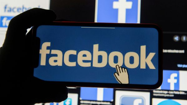 The Facebook logo is displayed on a mobile phone in this picture illustration taken 2 December 2019.  - Sputnik International