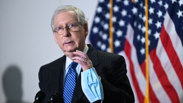 Senate Majority Leader Mitch McConnell (R-KY) holds a face mask while participating in a news conference at the U.S. Capitol in Washington, U.S., October 20, 2020. Senate Majority Leader Mitch McConnell (R-KY) holds a face mask while participating in a news conference at the U.S. Capitol in Washington, U.S., October 20, 2020. - Sputnik International