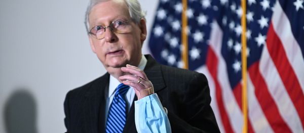 Senate Majority Leader Mitch McConnell (R-KY) holds a face mask while participating in a news conference at the U.S. Capitol in Washington, U.S., October 20, 2020. Senate Majority Leader Mitch McConnell (R-KY) holds a face mask while participating in a news conference at the U.S. Capitol in Washington, U.S., October 20, 2020. - Sputnik International