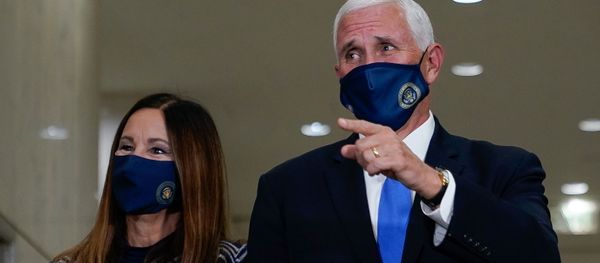 U.S. Vice President Mike Pence, stands with his wife, Karen, after casting his ballot for the upcoming election at a polling station in Indianapolis, Indiana, U.S. October 23, 2020. - Sputnik International