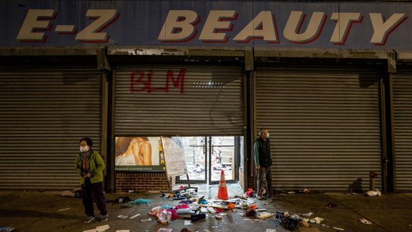 A business owner stands outside of her looted beauty supply store following protests over the police shooting death of Walter Wallace in Philadelphia, Pennsylvania, U.S., October 27, 2020. A business owner stands outside of her looted beauty supply store following protests over the police shooting death of Walter Wallace in Philadelphia, Pennsylvania, U.S., October 27, 2020. - Sputnik International