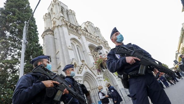 Police officers stand near Notre Dame church, where a knife attack took place, in Nice, France October 29, 2020. Police officers stand near Notre Dame church, where a knife attack took place, in Nice, France October 29, 2020. - Sputnik International