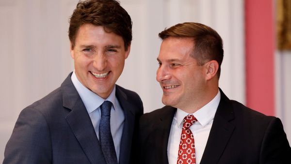 Marco Mendicino poses with Canada's Prime Minister Justin Trudeau after being sworn-in as Minister of Immigration, Refugees and Citizenship during the presentation of Trudeau's new cabinet, at Rideau Hall in Ottawa, Ontario, Canada November 20, 2019. - Sputnik International