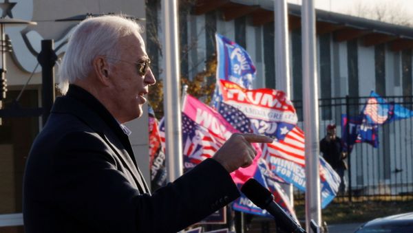 Democratic U.S. presidential nominee and former Vice President Joe Biden speaks as supporters of U.S. President Donald Trump hold up flags and posters nearby, during a drive-in campaign stop in St. Paul, Minnesota, U.S., October 30, 2020. Democratic U.S. presidential nominee and former Vice President Joe Biden speaks as supporters of U.S. President Donald Trump hold up flags and posters nearby, during a drive-in campaign stop in St. Paul, Minnesota, U.S., October 30, 2020. - Sputnik International