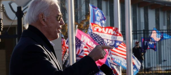 Democratic U.S. presidential nominee and former Vice President Joe Biden speaks as supporters of U.S. President Donald Trump hold up flags and posters nearby, during a drive-in campaign stop in St. Paul, Minnesota, U.S., October 30, 2020. Democratic U.S. presidential nominee and former Vice President Joe Biden speaks as supporters of U.S. President Donald Trump hold up flags and posters nearby, during a drive-in campaign stop in St. Paul, Minnesota, U.S., October 30, 2020. - Sputnik International