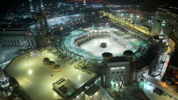 A general view of the Grand Mosque is pictured as the first group of Muslims, allowed in the mosque compound by appointment, practice social distancing, to perform Umrah, after Saudi authorities ease coronavirus disease (COVID-19) restrictions, in the holy city of Mecca, Saudi Arabia, October 3, 2020. REUTERS/Yasser Bakhsh  - Sputnik International