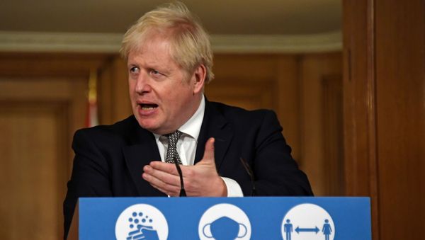 Britain's Prime Minister Boris Johnson speaks during a press conference at 10 Downing Street in London - Sputnik International