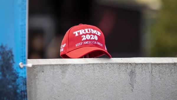 A supporter of President Trump set down a hat supporting his reelection during a speech by Democratic presidential candidate U.S. Sen. Kirsten Gillibrand (D-NY) at the Iowa State Fair on August 10, 2019 in Des Moines, Iowa. A supporter of President Trump set down a hat supporting his reelection during a speech by Democratic presidential candidate U.S. Sen. Kirsten Gillibrand (D-NY) at the Iowa State Fair on August 10, 2019 in Des Moines, Iowa. - Sputnik International