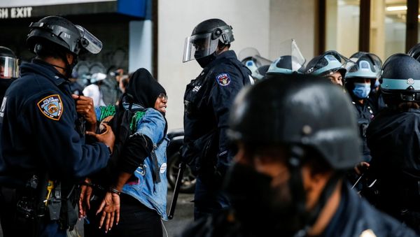 A woman is detained while Black Lives Matter members and people confront NYPD during a march against far right movement and Trump administration in the Manhattan borough of New York City, U.S. November 1, 2020. - Sputnik International