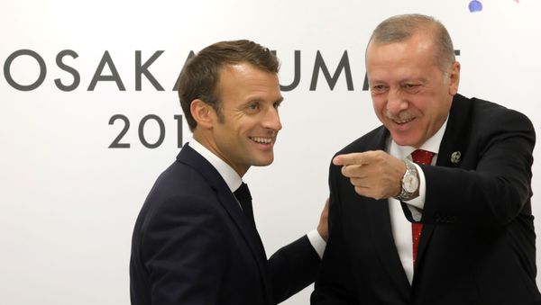 In this file photo taken on 28 June 2019 France's President Emmanuel Macron meets with Turkey's President Recep Tayyip Erdogan on the sidelines of the G20 Summit in Osaka. (Photo by Ludovic MARIN / AFP) - Sputnik International