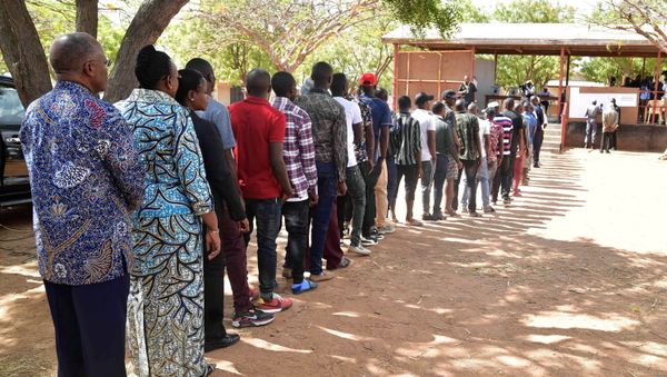 Tanzanian President John Pombe Magufuli and First Lady Janeth stand in the queue before casting their ballots at a polling centre during the Presidential and Parliamentary elections in Chamwino district in Dodoma, Tanzania October 28, 2020 - Sputnik International