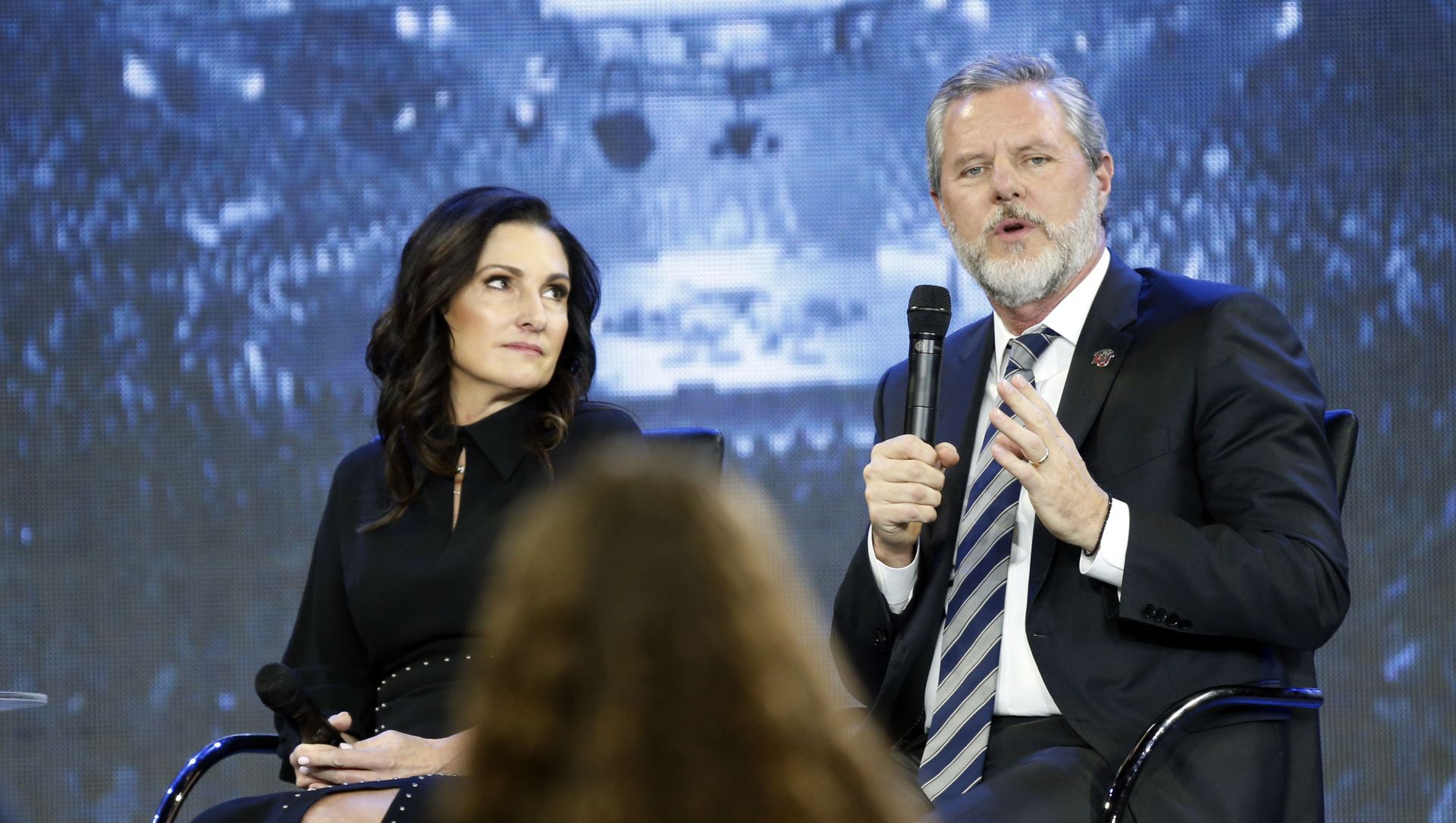 In this Wednesday, Nov. 28, 2018 file photo, Jerry Falwell Jr., right, answers a student's question, accompanied by his wife, Becki, during a town hall meeting on the opioid crisis at a convocation at Liberty University in Lynchburg, Va. On Aug. 7, 2020, Falwell stepped down, at least temporarily, from his role as the president of the school. In this Wednesday, Nov. 28, 2018 file photo, Jerry Falwell Jr., right, answers a student's question, accompanied by his wife, Becki, during a town hall meeting on the opioid crisis at a convocation at Liberty University in Lynchburg, Va. On Aug. 7, 2020, Falwell stepped down, at least temporarily, from his role as the president of the school. - Sputnik International, 1920, 17.04.2021