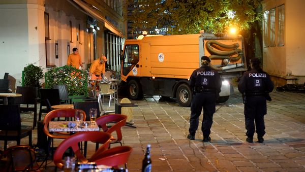 Hastily left drinks are seen on a table as cleaning crews and police work outside a restaurant near the scene of an attack in Vienna, Austria on November 3, 2020, one day after a shooting at multiple locations across central Vienna. Hastily left drinks are seen on a table as cleaning crews and police work outside a restaurant near the scene of an attack in Vienna, Austria on November 3, 2020, one day after a shooting at multiple locations across central Vienna. - Sputnik International