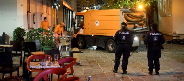 Hastily left drinks are seen on a table as cleaning crews and police work outside a restaurant near the scene of an attack in Vienna, Austria on November 3, 2020, one day after a shooting at multiple locations across central Vienna. Hastily left drinks are seen on a table as cleaning crews and police work outside a restaurant near the scene of an attack in Vienna, Austria on November 3, 2020, one day after a shooting at multiple locations across central Vienna. - Sputnik International