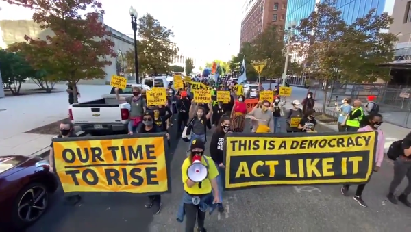 Protesters march in Washington, DC, on November 4, 2020, against US President Donald Trump's premature declaration of victory in the US presidential election the day prior - Sputnik International