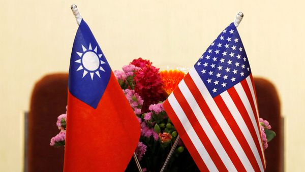 Flags of Taiwan and U.S. are placed for a meeting between U.S. House Foreign Affairs Committee Chairman Ed Royce speaks and with Su Chia-chyuan, President of the Legislative Yuan in Taipei, Taiwan March 27, 2018. Flags of Taiwan and U.S. are placed for a meeting between U.S. House Foreign Affairs Committee Chairman Ed Royce speaks and with Su Chia-chyuan, President of the Legislative Yuan in Taipei, Taiwan March 27, 2018. - Sputnik International