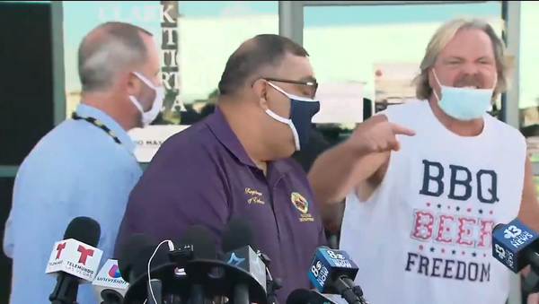 A screenshot from a video of a man interrupting a live on-air press conference about the vote-counting process in Clark County, Nevada, US, by yelling ‘Biden crime family is stealing the election’ as the nation awaits the results of the 2020 presidential election. - Sputnik International