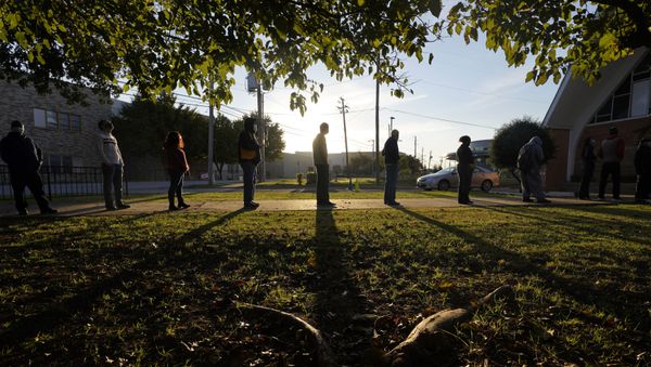 Voters line up outside Vickery Baptist Church waiting to cast their ballots on Election Day Tuesday, Nov. 3, 2020, in Dallas. - Sputnik International