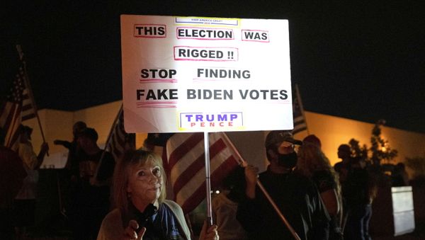 Judy Goff, a supporter of President Donald Trump, holds a sign during a Stop the Steal protest at the Clark County Election Center in North Las Vegas, Nevada, U.S. November 5, 2020. REUTERS/Steve Marcus Judy Goff, a supporter of President Donald Trump, holds a sign during a Stop the Steal protest at the Clark County Election Center in North Las Vegas, Nevada, U.S. November 5, 2020. REUTERS/Steve Marcus - Sputnik International
