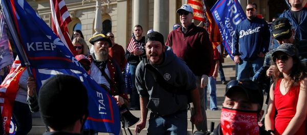 Supporters of U.S. President Donald Trump rally outside the State Capitol building as votes continue to be counted following the 2020 U.S. presidential election, in Lansing - Sputnik International