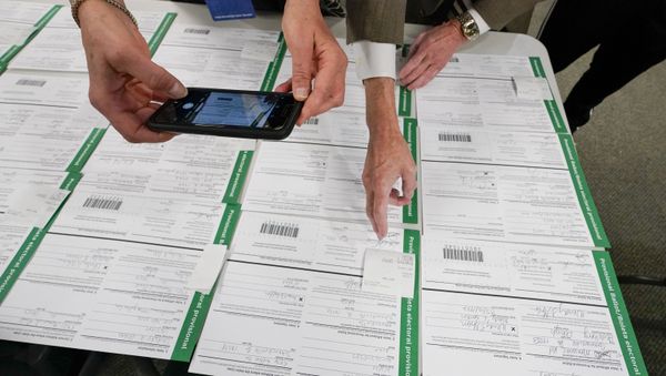 A canvas observer photographs Lehigh County provisional ballots as vote counting in the general election continues, Friday, Nov. 6, 2020, in Allentown, Pa - Sputnik International