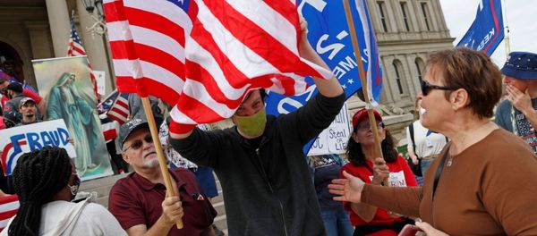 Protesters rally outside the State Capitol building after former Vice President Joe Biden was declared the winner of the 2020 U.S. presidential election, in Lansing, Michigan, U.S., November 8, 2020 - Sputnik International