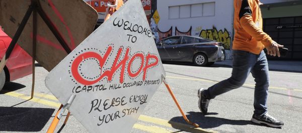 A sign welcomes visitors Monday, June 22, 2020, near an entrance to what has been named the Capitol Hill Occupied Protest zone in Seattle. For the second time in less than 48 hours, there was a shooting near the CHOP area that has been occupied by protesters after Seattle Police pulled back from several blocks of the city's Capitol Hill neighborhood near the Police Department's East Precinct building A sign welcomes visitors Monday, June 22, 2020, near an entrance to what has been named the Capitol Hill Occupied Protest zone in Seattle. For the second time in less than 48 hours, there was a shooting near the CHOP area that has been occupied by protesters after Seattle Police pulled back from several blocks of the city's Capitol Hill neighborhood near the Police Department's East Precinct building - Sputnik International