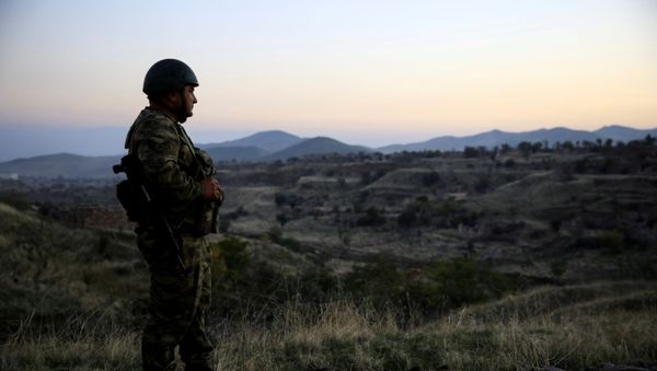 An Azeri soldier inspects the city of Cebrayil, where Azeri forces regained control during the fighting over the breakaway region of Nagorno-Karabakh, Azerbaijan October 16, 2020 - Sputnik International
