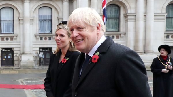Britain's Prime Minister Boris Johnson with partner Carrie Symonds attend the National Service of Remembrance at The Cenotaph on Whitehall amid the coronavirus pandemic in London, Britain November 8, 2020 Britain's Prime Minister Boris Johnson with partner Carrie Symonds attend the National Service of Remembrance at The Cenotaph on Whitehall amid the coronavirus pandemic in London, Britain November 8, 2020 - Sputnik International