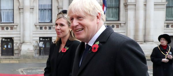 Britain's Prime Minister Boris Johnson with partner Carrie Symonds attend the National Service of Remembrance at The Cenotaph on Whitehall amid the coronavirus pandemic in London, Britain November 8, 2020 Britain's Prime Minister Boris Johnson with partner Carrie Symonds attend the National Service of Remembrance at The Cenotaph on Whitehall amid the coronavirus pandemic in London, Britain November 8, 2020 - Sputnik International