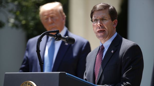 Defense Secretary Mark Esper speaks as President Donald Trump listens during a press briefing about the coronavirus in the Rose Garden of the White House, Friday, May 15, 2020, in Washington. (AP Photo/Alex Brandon) - Sputnik International