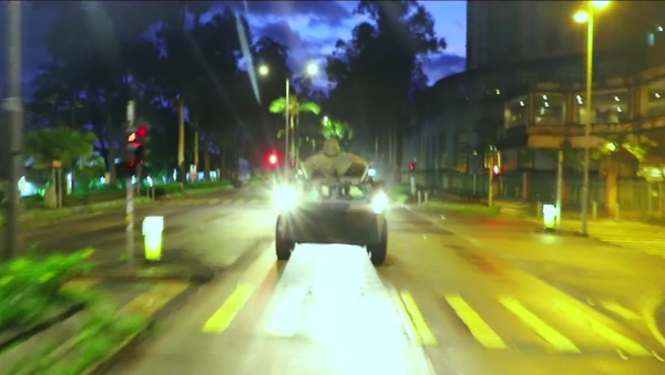 An armored personnel carrier of China's People's Liberation Army's Hong Kong garrison rolls down streets on their way to mountain drills - Sputnik International
