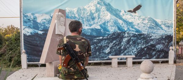 An Armenian soldier looks at the picture sitting on a stone bench in Martakert, the self-proclaimed Nagorno-Karabakh Republic - Sputnik International