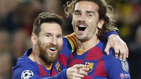 Barcelona's Lionel Messi, left, celebrates after scoring his side's second goal with Antoine Griezmann during a Champions League soccer match Group F between Barcelona and Dortmund at the Camp Nou stadium in Barcelona, Spain, Wednesday, Nov. 27, 2019 Barcelona's Lionel Messi, left, celebrates after scoring his side's second goal with Antoine Griezmann during a Champions League soccer match Group F between Barcelona and Dortmund at the Camp Nou stadium in Barcelona, Spain, Wednesday, Nov. 27, 2019 - Sputnik International